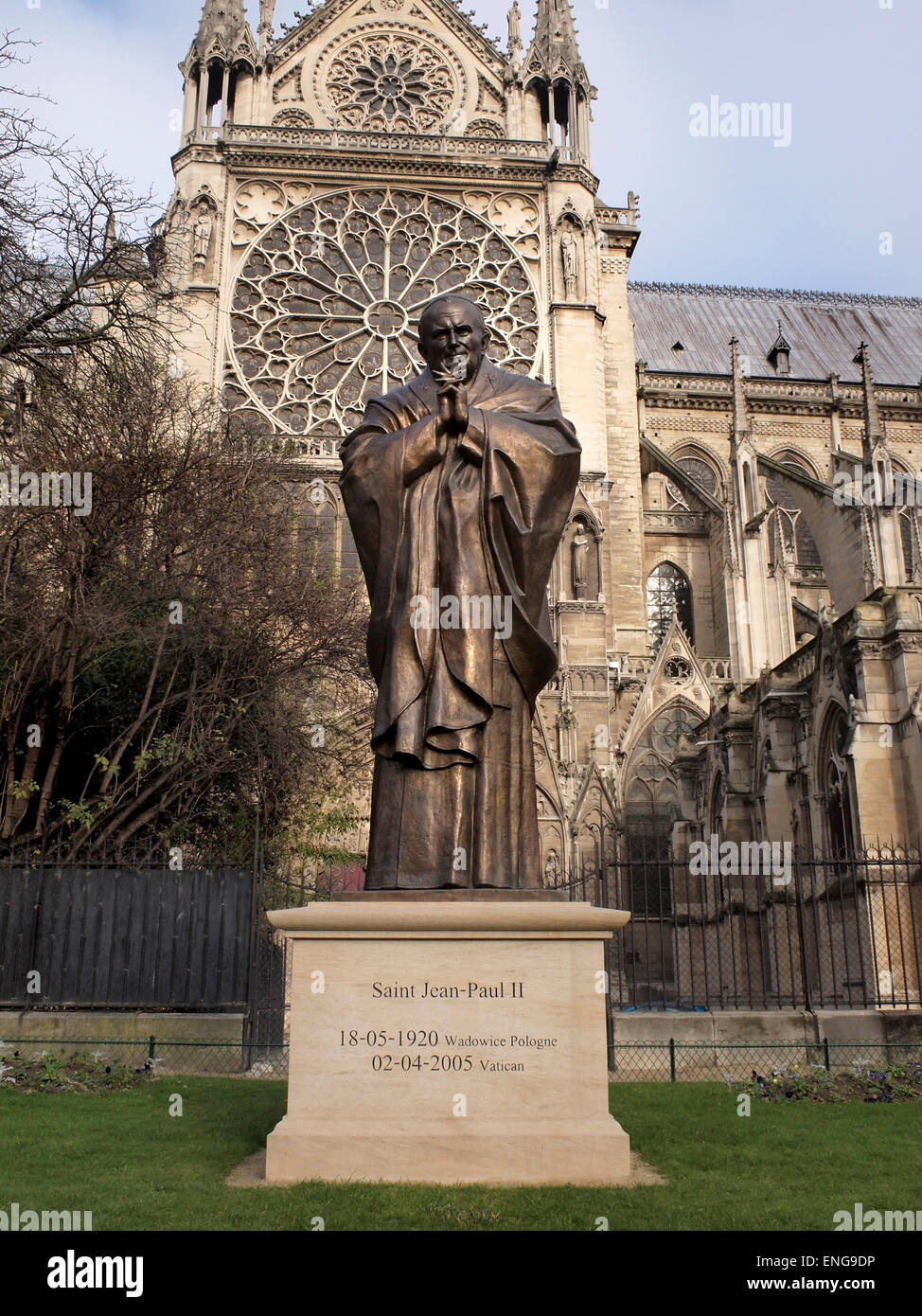 Bronze statue of Polish Pope John Paul II next to the Notre Dame cathedral in Paris, France