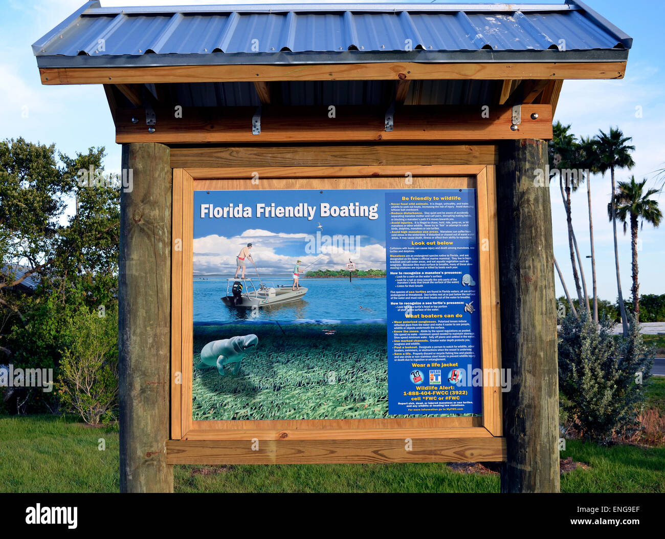 An illustrated sign at a boat launching site urges all boaters to be friendly to Florida wildlife, especially manatees, sea turtles and dolphins. Stock Photo