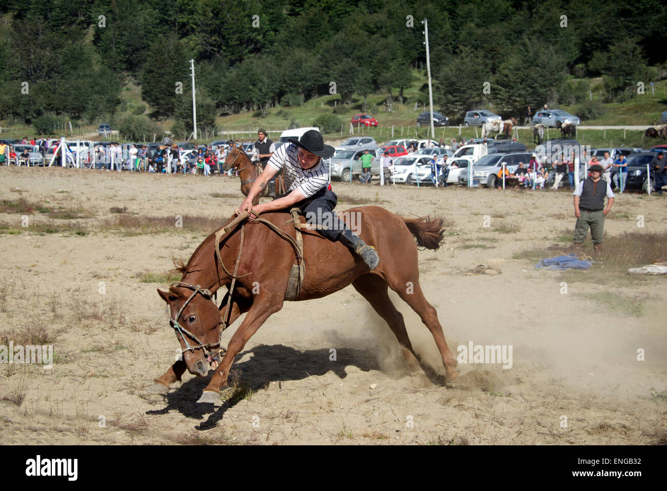 Gaucho riding a bucking bronco country rodeo Tierra del Fuego Argentina Stock Photo