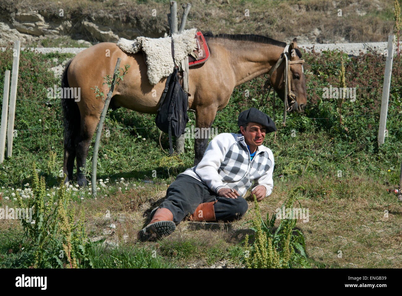 Gaucho with horse relaxing country rodeo Tierra del Fuego Argentina Stock Photo