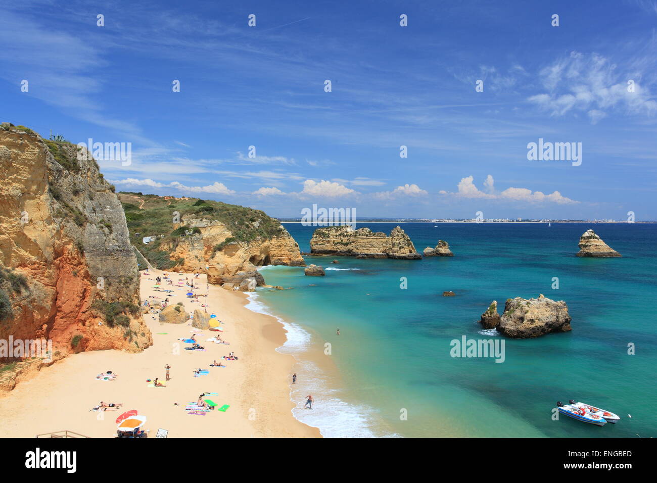 Overlooking the beach of Praia da Dona Ana at Lagos on the Algarve in Portugal. Popular with locals and tourists alike, it is a haven for sunbathers. Stock Photo