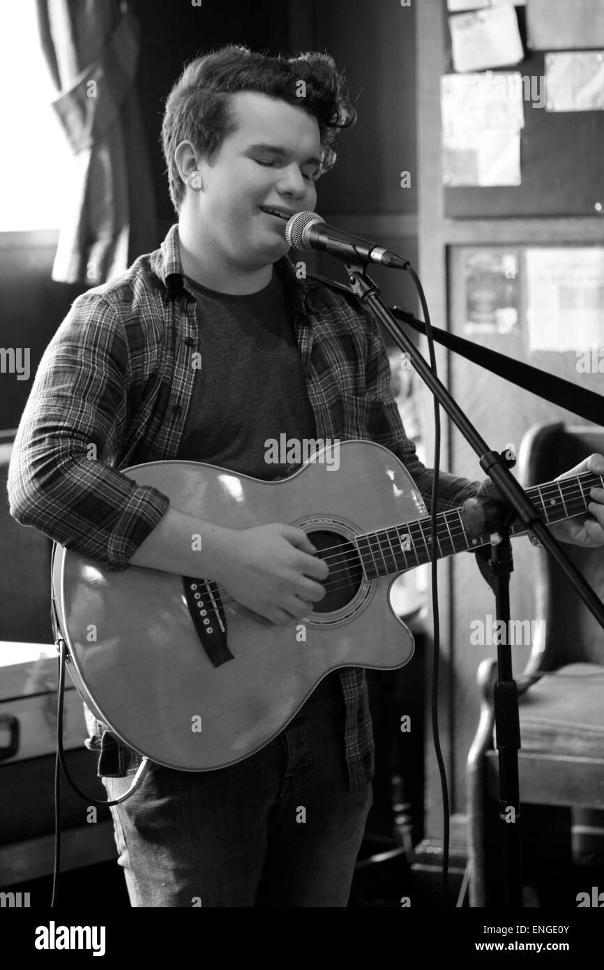 young local male singer marley blanford playing a set at the barley mow pub in southsea england uk Stock Photo