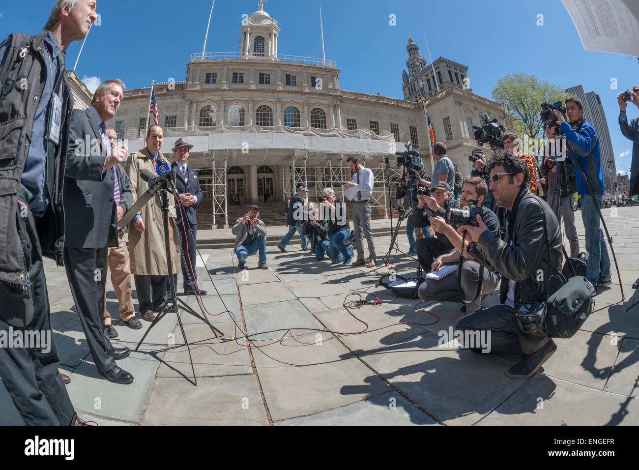 Council member Daniel Dromm, at podium, with other members of the New York City Council and officers of the NY Press Photographers Association at a news conference at City Hall on Tuesday, April 28, 2015 calling for the restoration of the parking placards which were arbitrarily suspended by the NYPD in 2009. Without the parking privileges it is difficult for members of the press to cover breaking news without incurring summons'.(© Richard B. Levine) Stock Photo