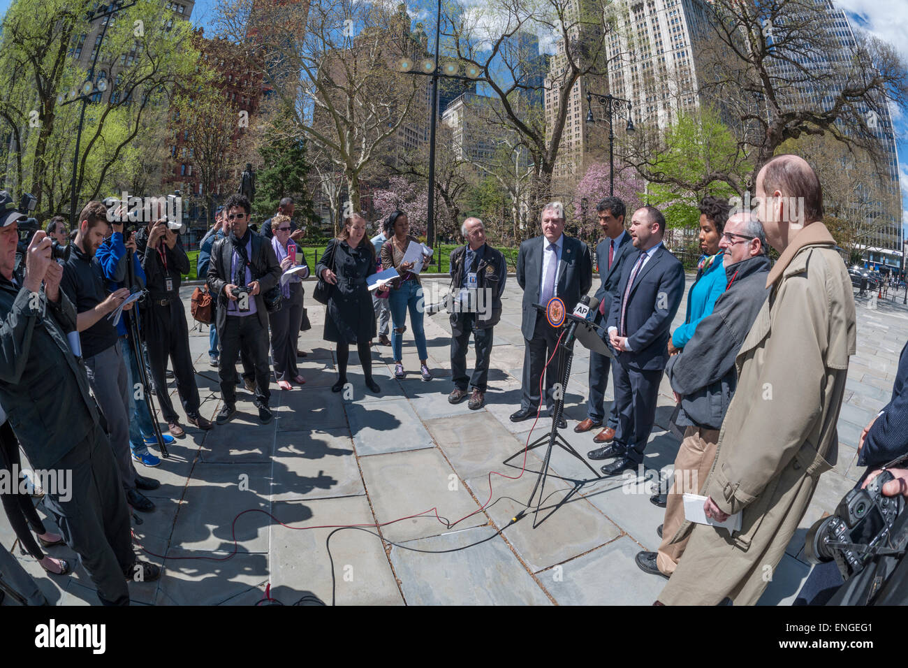 Council member Corey Johnson, at podium, with other members of the New York City Council and officers of the NY Press Photographers Association at a news conference at City Hall on Tuesday, April 28, 2015 calling for the restoration of the parking placards which were arbitrarily suspended by the NYPD in 2009. Without the parking privileges it is difficult for members of the press to cover breaking news without incurring summons'.(© Richard B. Levine) Stock Photo