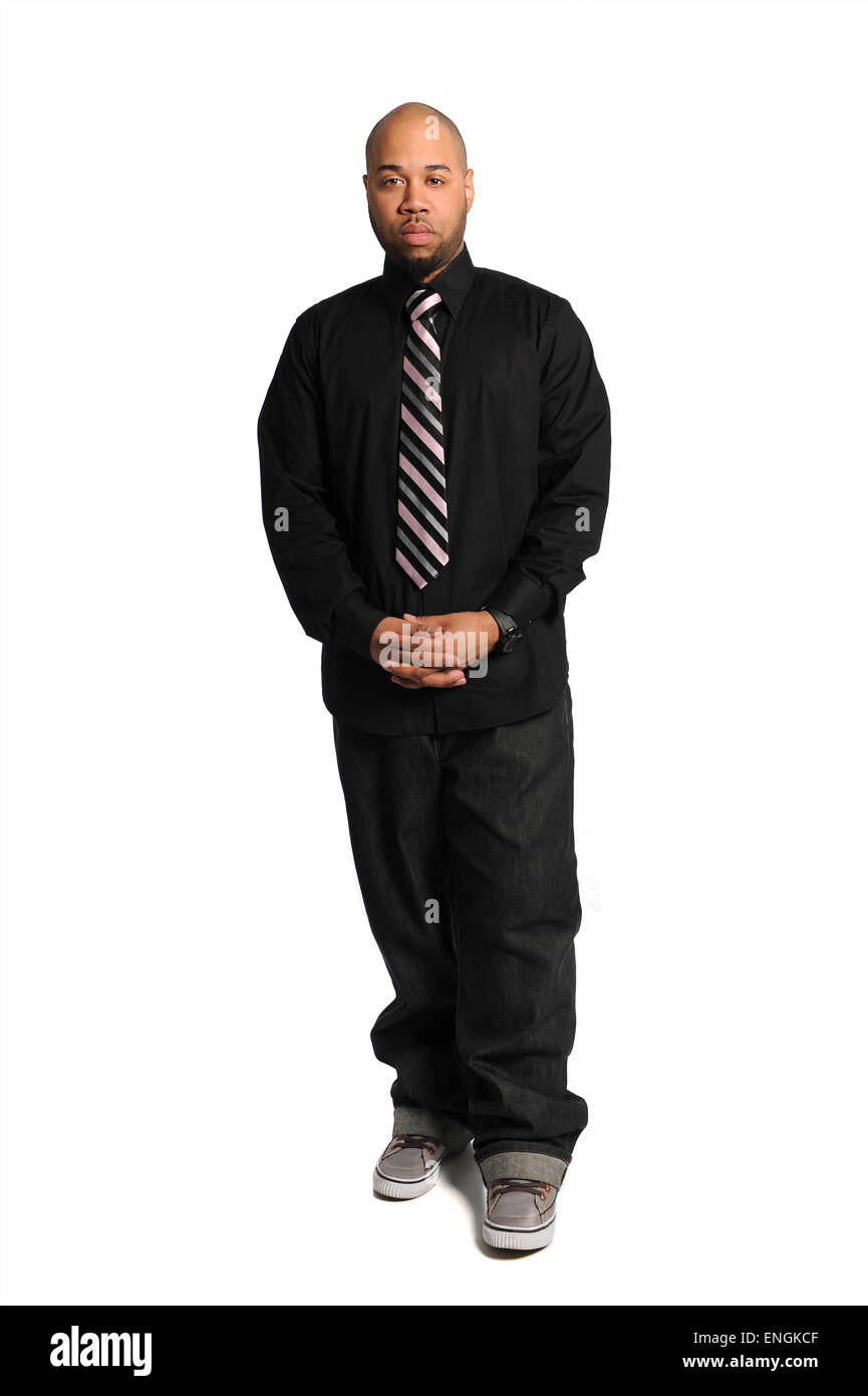 Portrait of young African American businessman standing isolated over ...