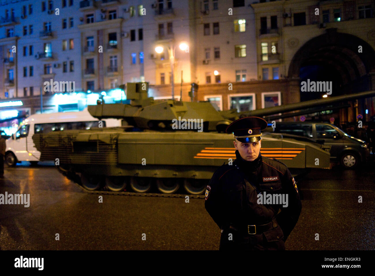 Moscow, Russia. 04th May, 2015. A policeman guarding Tverskaya Street as a newly developed T-14 tank passes by. - Russian military hardwares including the latest developed T-14 tank participated in the 70th Victory day parade rehearsal. 4th May 2015 © Geovien So/Pacific Press/Alamy Live News Stock Photo