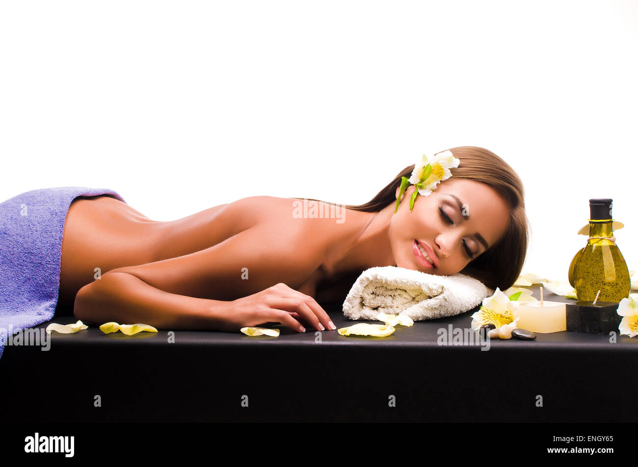 Beautiful young woman having a massage in a spa Stock Photo