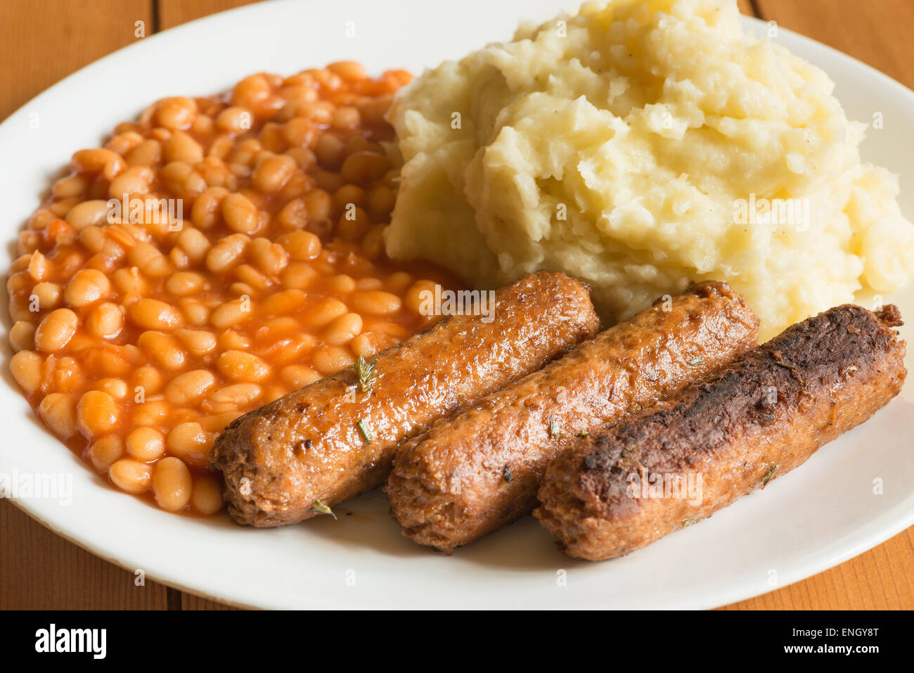 traditional bangers mash and baked beans but vegetarian style twist on the theme Stock Photo