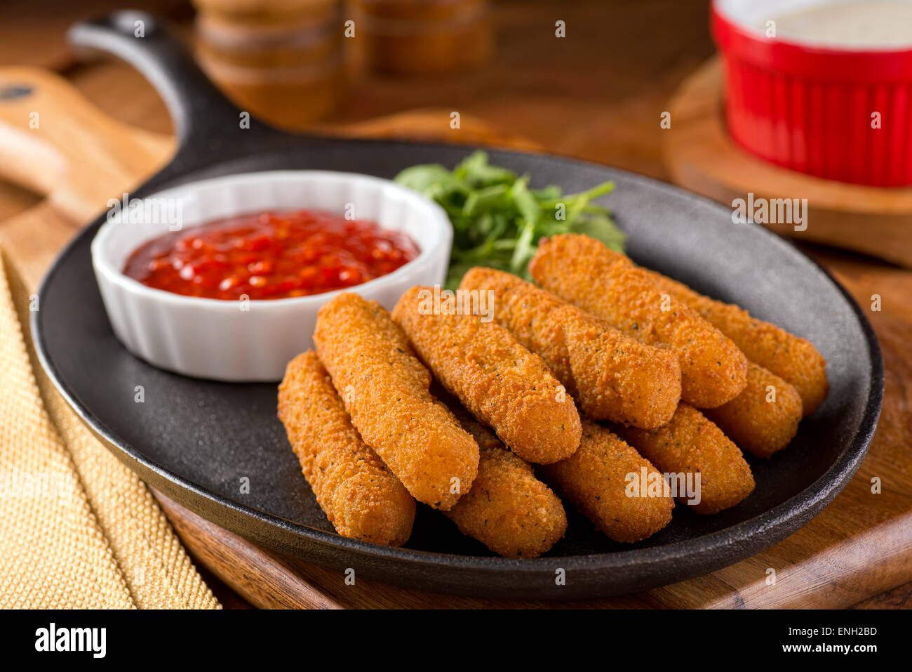 Delicious breaded mozzarella cheese sticks with marinara dipping sauce