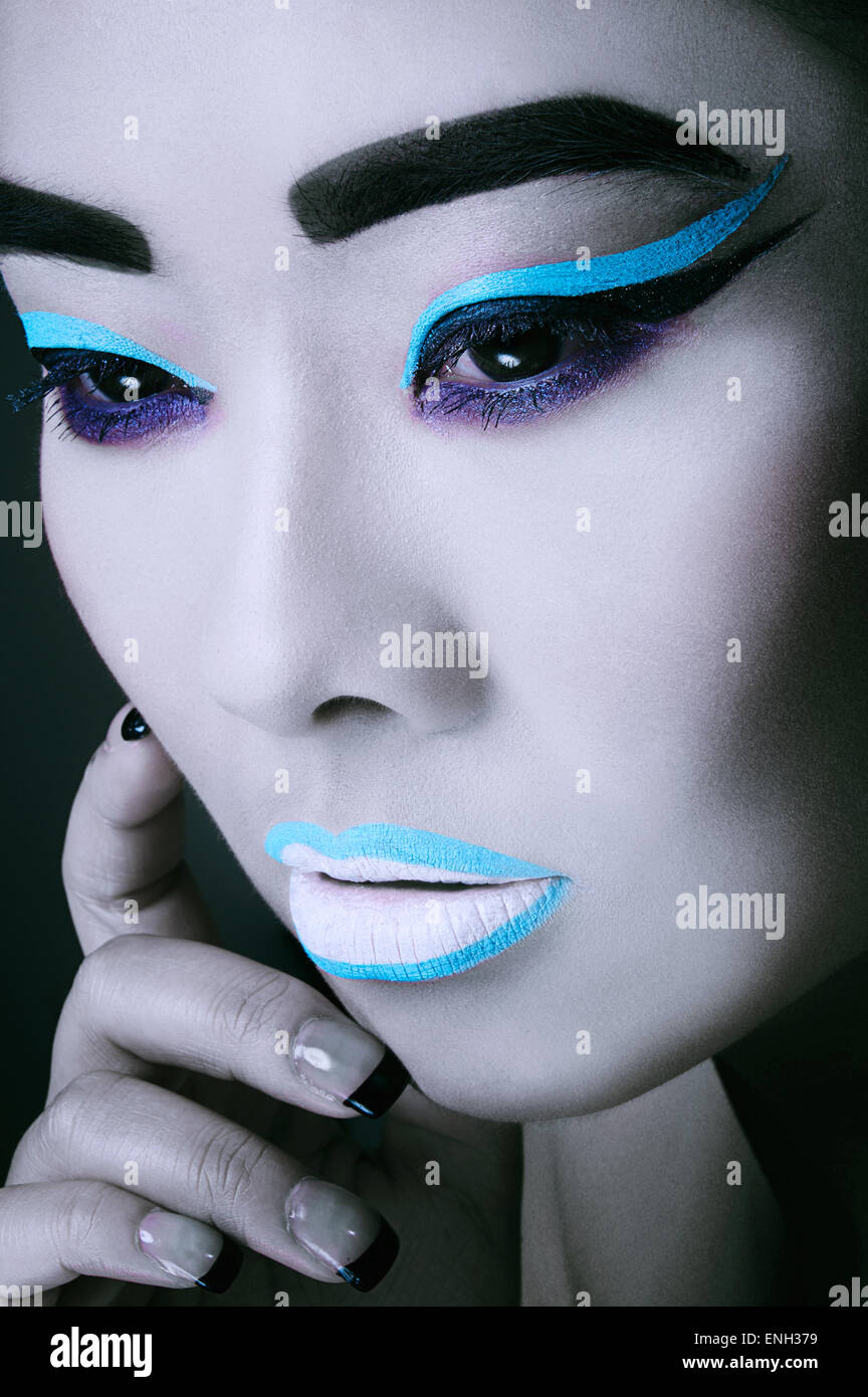 Beauty close-up of East Asian young woman in bold make-up Stock Photo