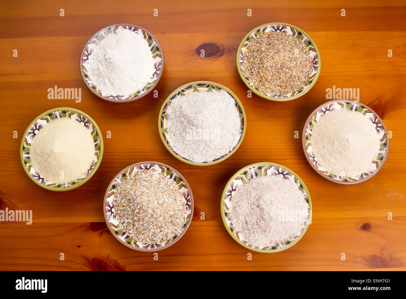 Various kinds of flour and grains including bread flour, ten grain cereal, kamut flour, whole wheat flour, oat bran & rye flour Stock Photo