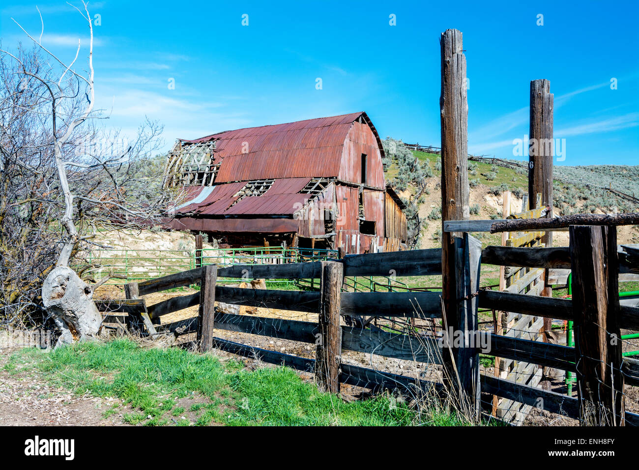 Red rusted barn and weathered corral Stock Photo