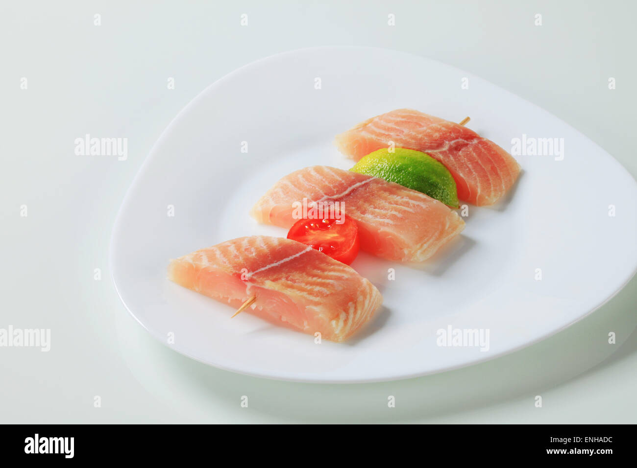 Raw fish skewer on a plate Stock Photo