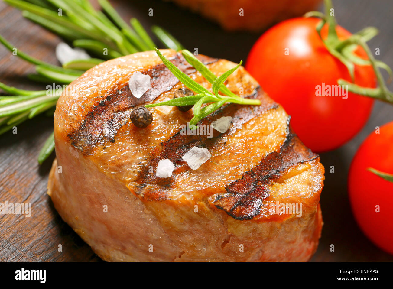 Grilled pork medallion on wood Stock Photo