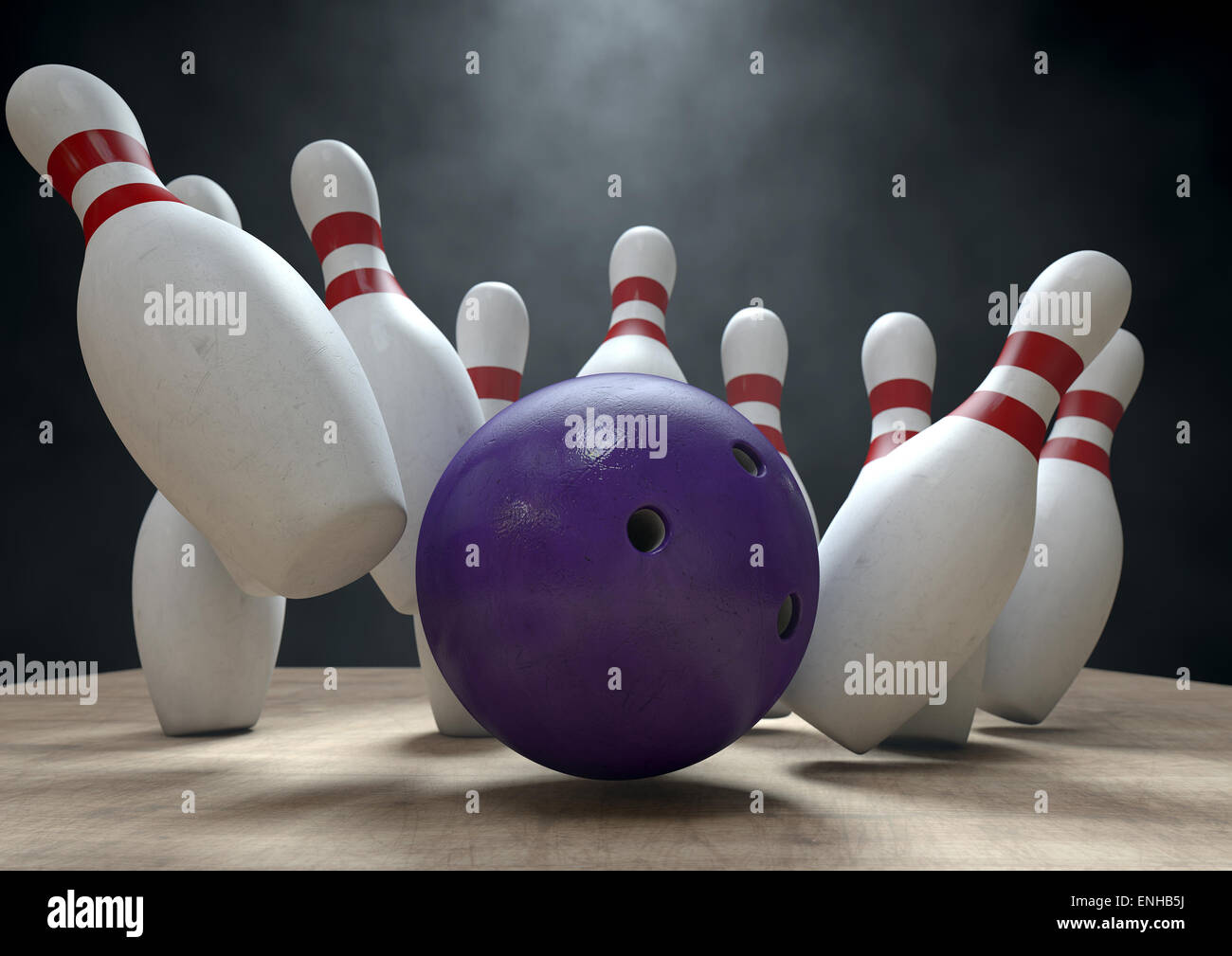 An arrangement of white and red used vintage bowling pins being struck