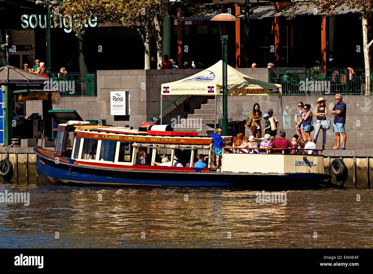 Melbourne Australia / A cruise boat takes on passengers for sightseeing along Melbourne`s Yarra River. Stock Photo