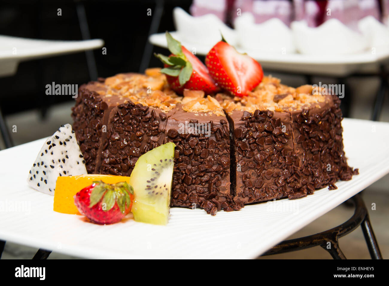 Chocolate cakes with strawberry and kiwi on top Stock Photo - Alamy