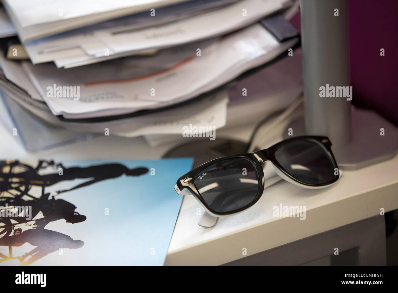sunglasses on office desk Stock Photo