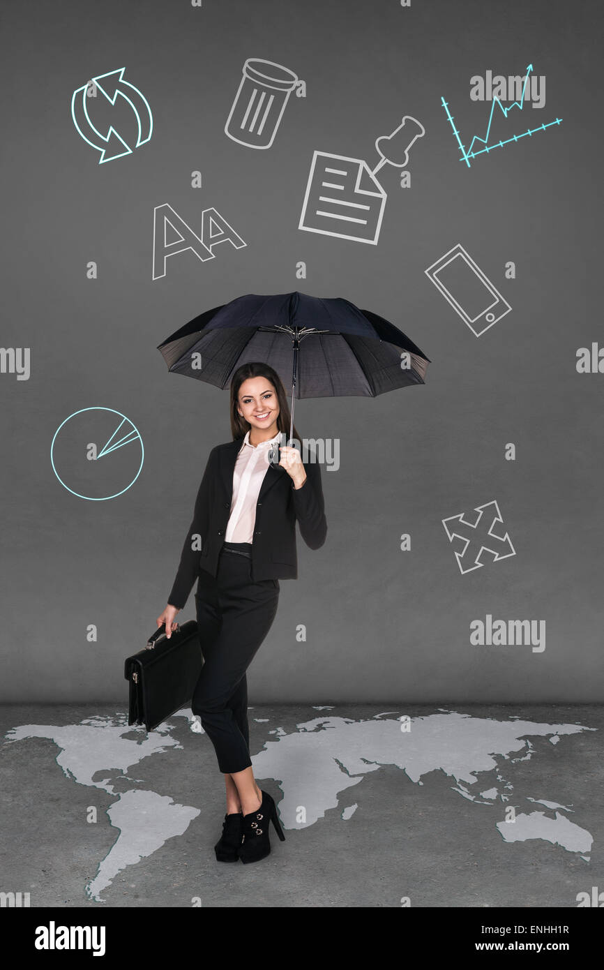 Pretty businesswoman holding umbrella Stock Photo
