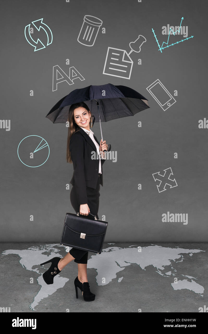 Pretty businesswoman holding umbrella Stock Photo