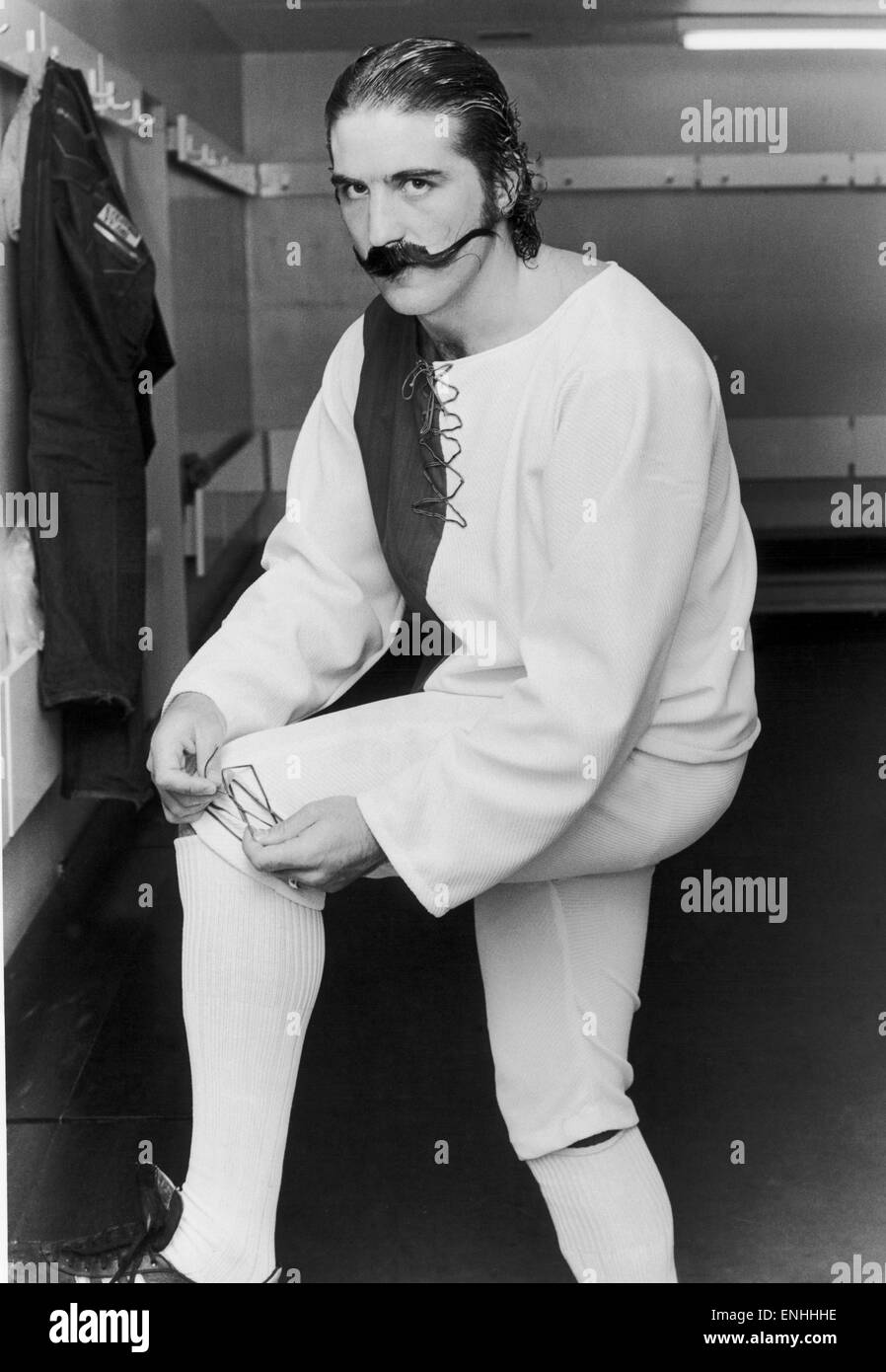 Everton footballer Bob Latchford tries out the strip which was worn by his team's predecessers 100 years ago in 1878, complete with old fashioned moustache. 1978. Stock Photo