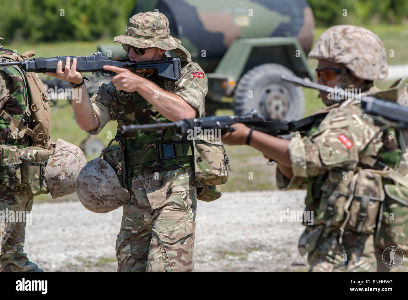 Infantryman with Bermuda Regiment engage a simulated enemy while conducting a patrolling and tactics class during Exercise Island Warrior May 4, 2015 in Camp Lejeune, N.C. Stock Photo