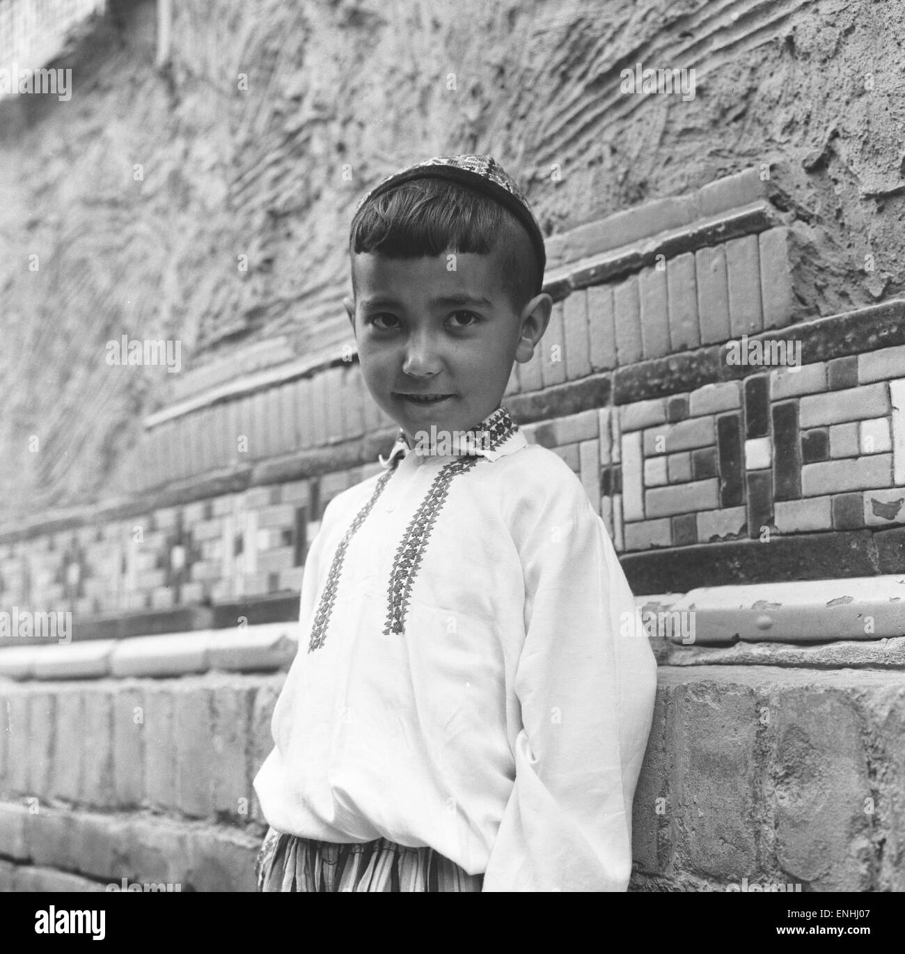 Small boy seen here dressed in the national costume of the central steppes of Russia. 25th May 1960 Stock Photo