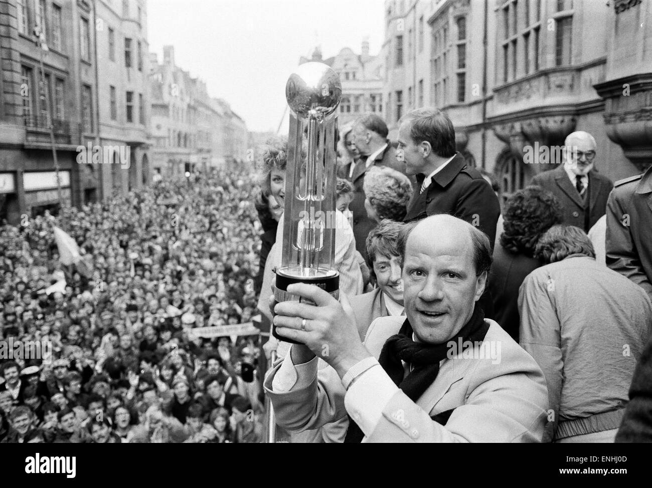 Oxford United FC manager Jim Smith, holds aloft the Second Division Championship trophy on an open top bus parade, cheered by thousands of fans who lined the streets of Oxford to celebrate their team's success. 13th May 1985. Stock Photo