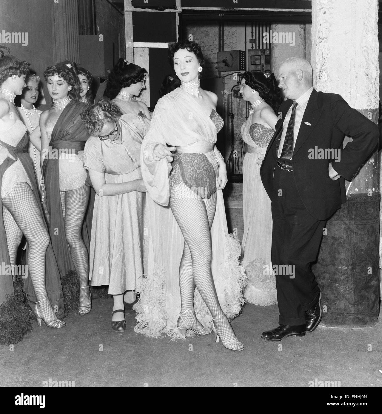 The Busman Goes To France Feature, July 1953. Bill and Hilda Masters in Paris to visit their daughter, Sheila Masters, who is a member of the famous dance troupe, the Bluebell Girls at Le Lido on the Champs-Elysees in Paris, France. Pictured: a last minut Stock Photo