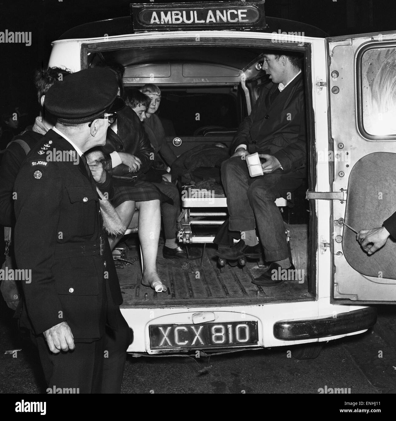 Everton fan is helped into an ambulance 