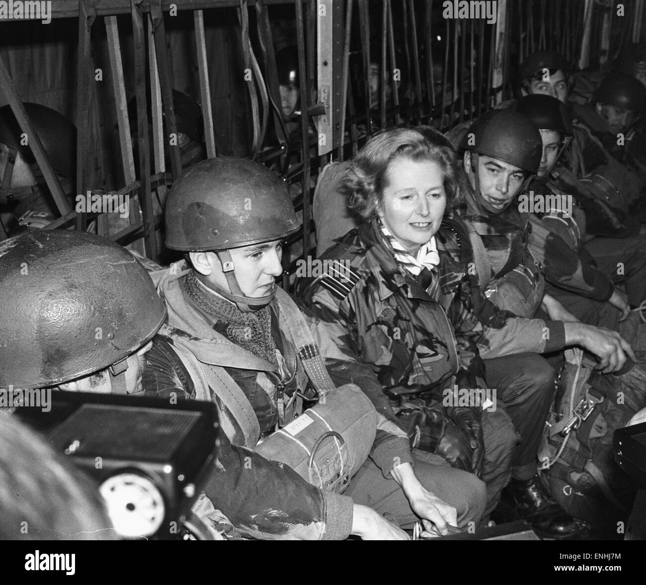 Margaret Thatcher seen here during a visit to the Parachute Regiment. Seen here sitting and chatting to the tropps in a Hercules aircraft, just prior to the soldiers completing a parachute jump. 20th November 1977 Stock Photo