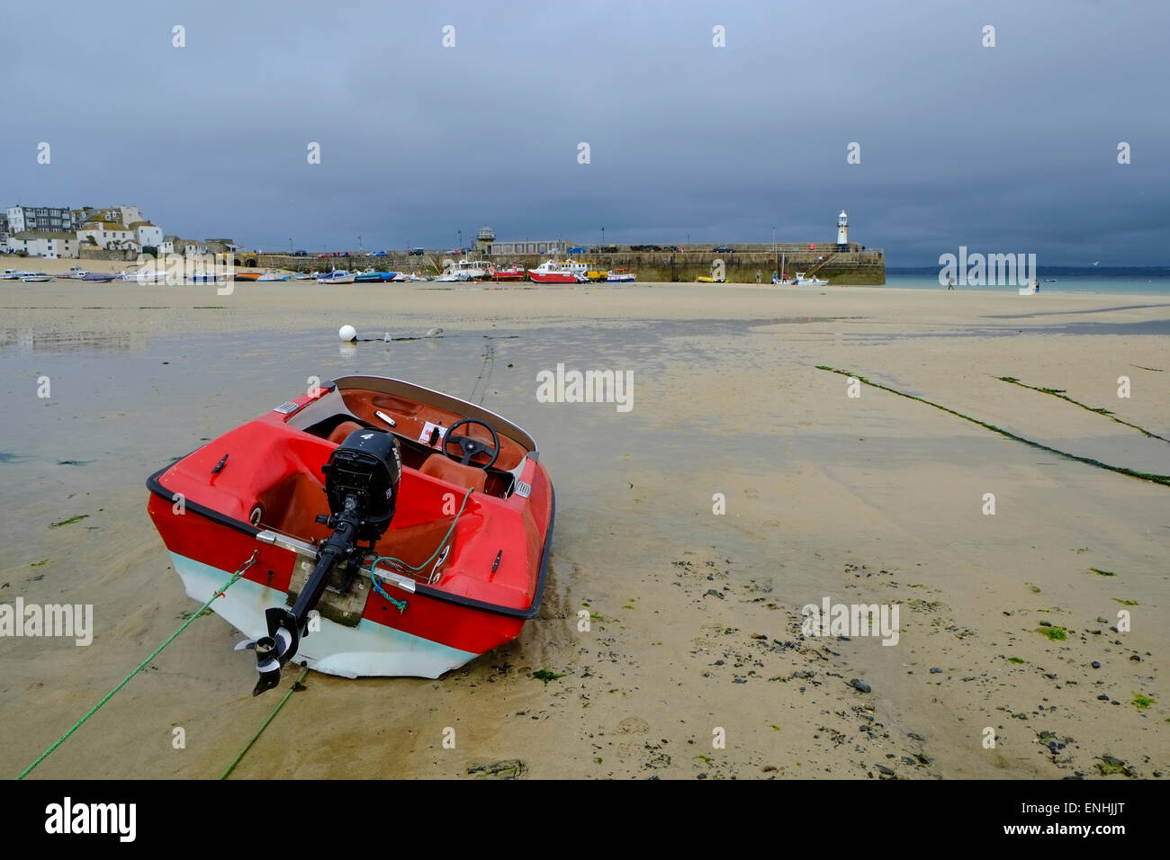 Red hire boat on the beach at St Ives in Cornwall Stock Photo