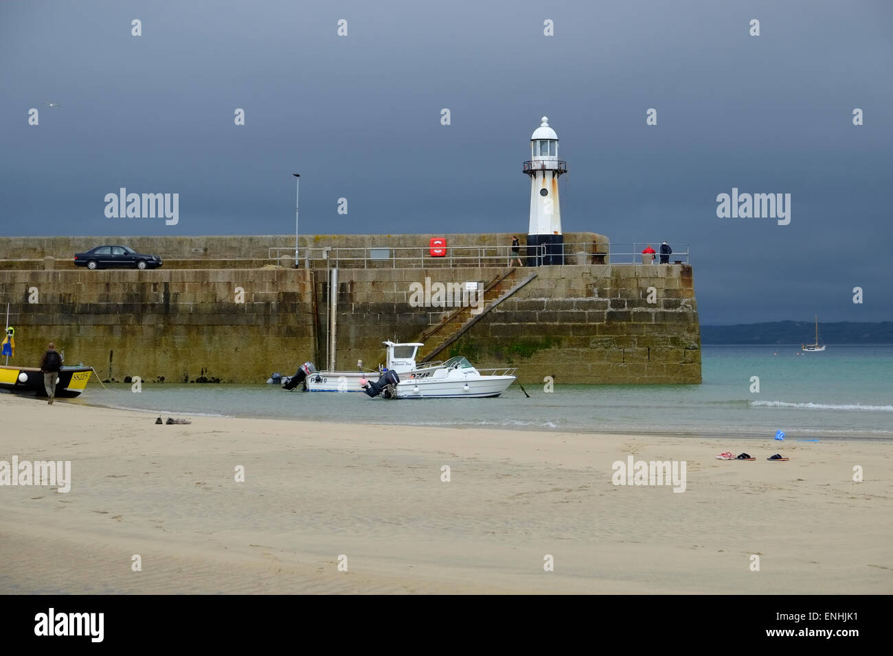 Smeaton's Pier at St Ives in Cornwall as rain clouds approach Stock ...