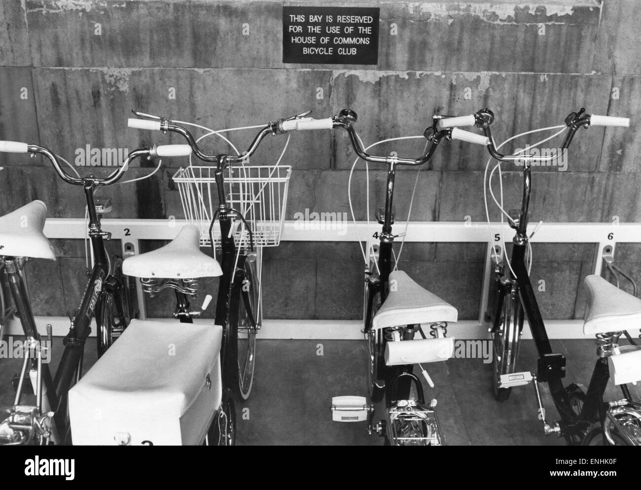 Britain's members of Parliament moved in to a new age on Wednesday (13-7-77) - the age of the bicycle. At least twelve Honorable Gentlemen took to the road to launch the House of Commons new rent-a-bike scheme. The House of Commons new 'bike park'. July 1 Stock Photo