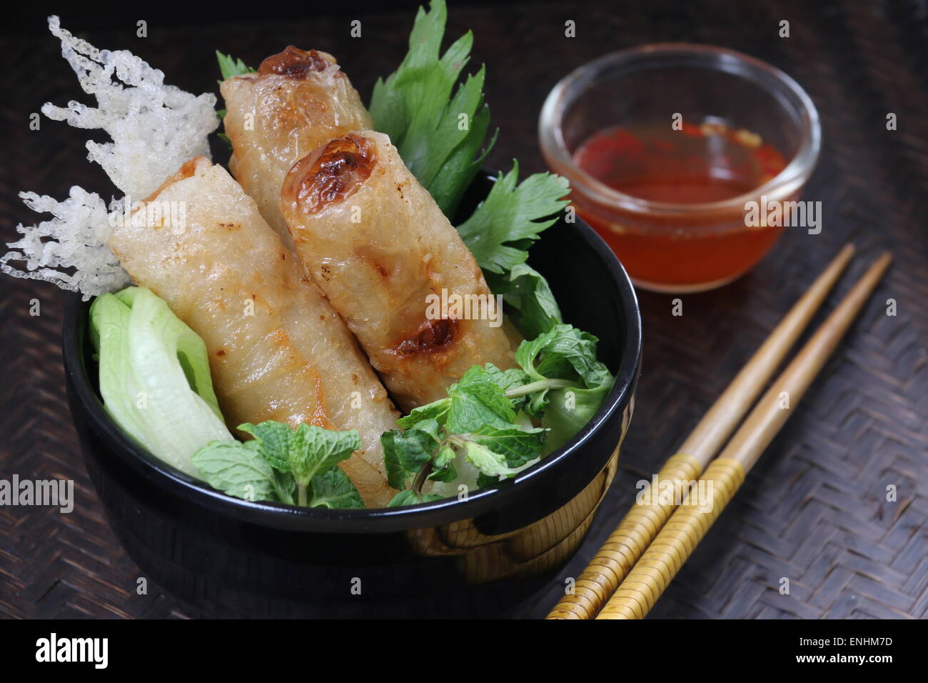 Cha Gio, Vietnamese fried spring rolls, served with chili dipping sauce Stock Photo