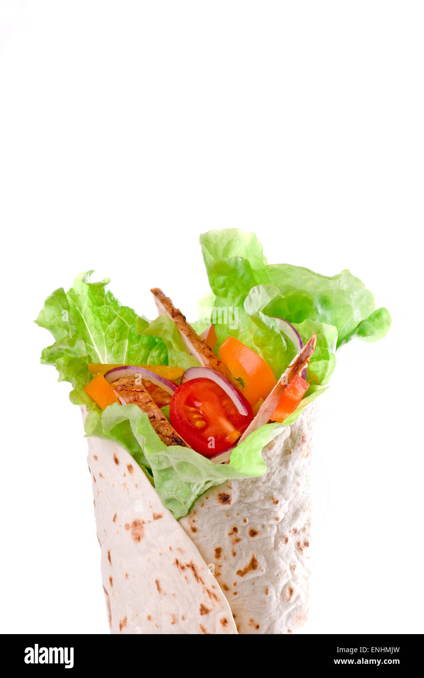 Tortilla wrap with vegetables and meat. Stock Photo
