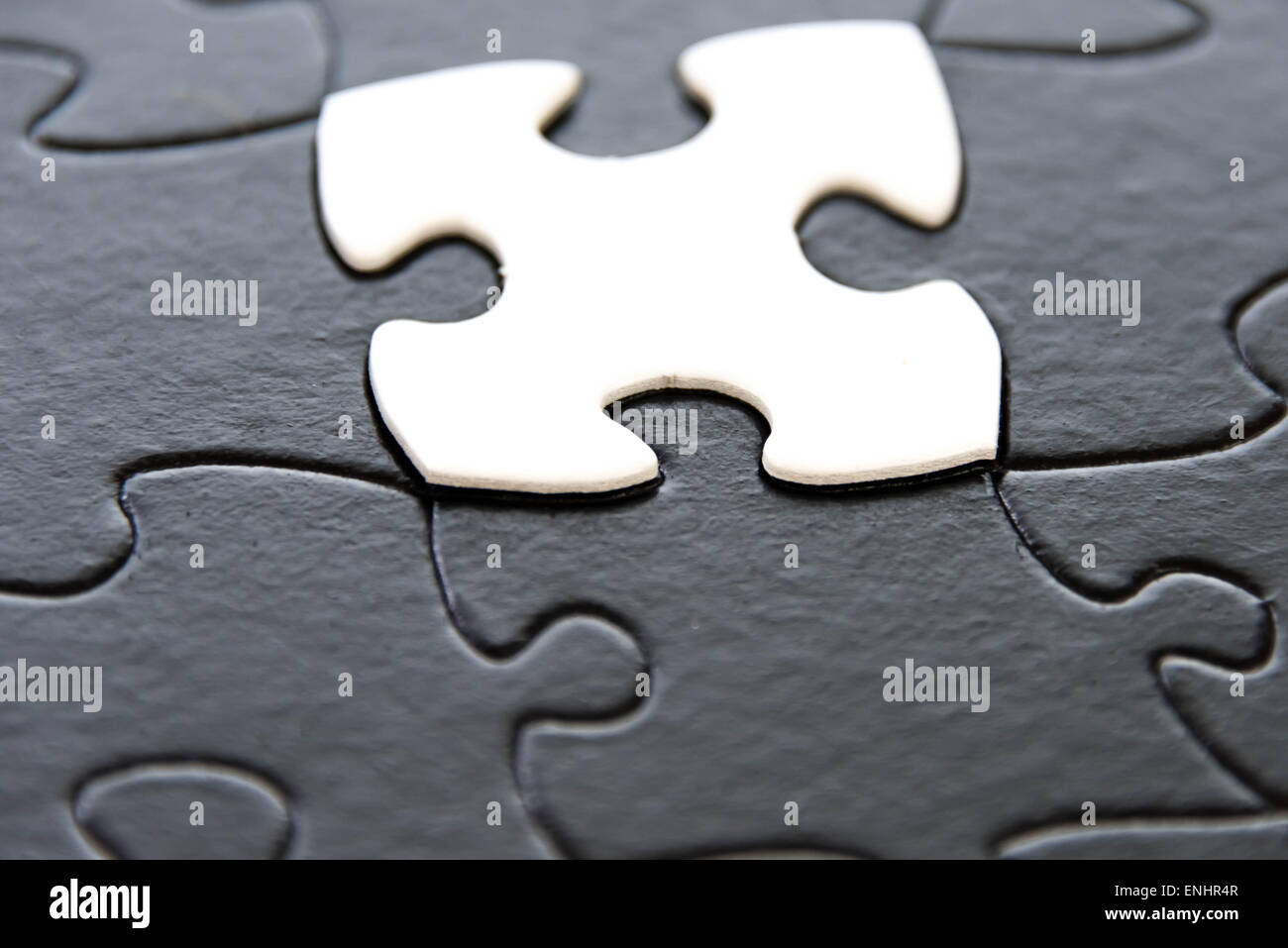 black and white puzzle pieces contrasting Stock Photo