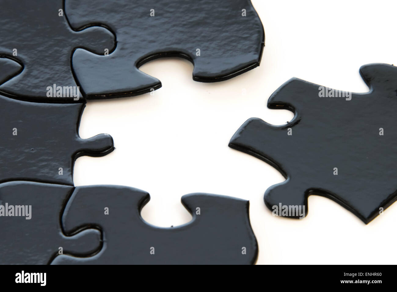 black and white puzzle pieces contrasting Stock Photo