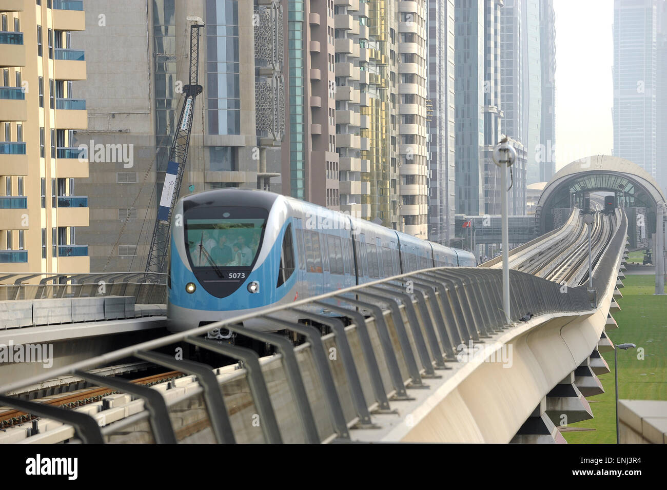Dubai metro  train leaving station along Sheikh Zeyad Road in the United Arab Emirates Stock Photo