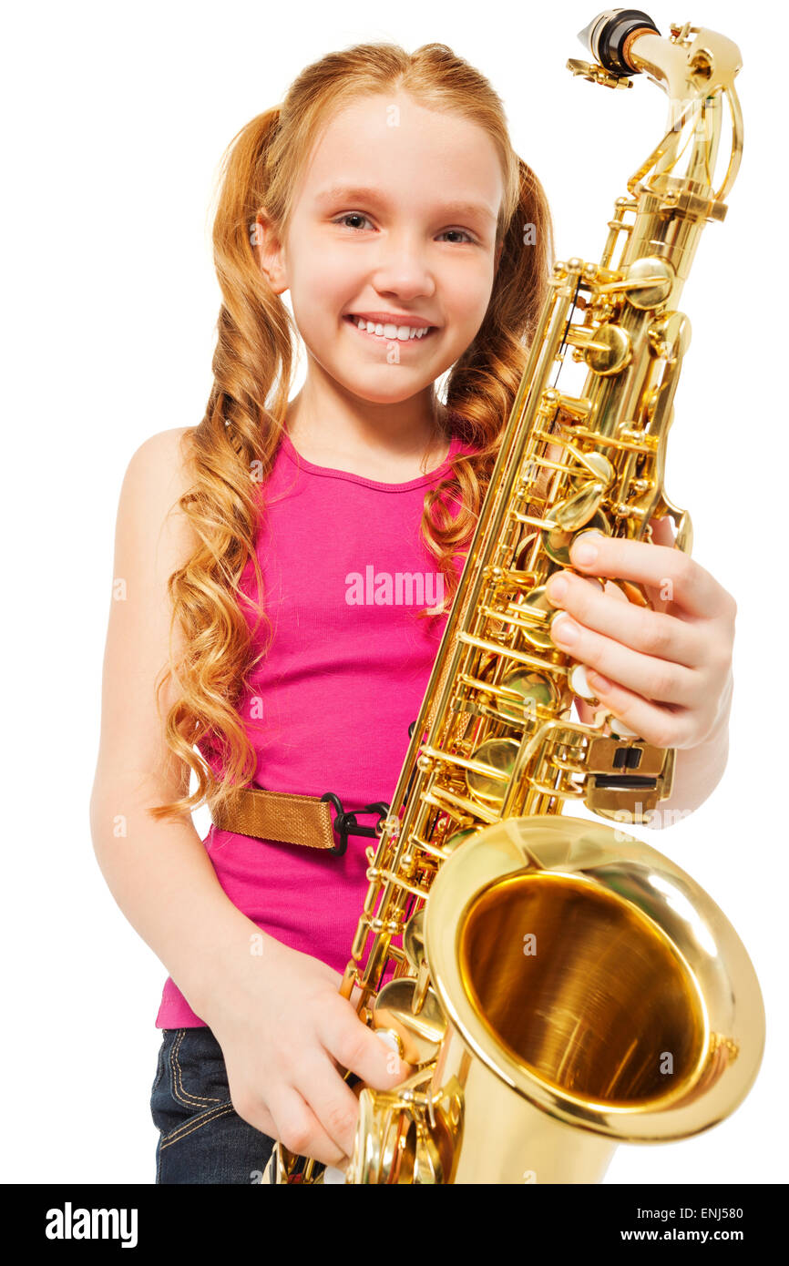 Portrait of happy girl playing alto saxophone Stock Photo Alamy