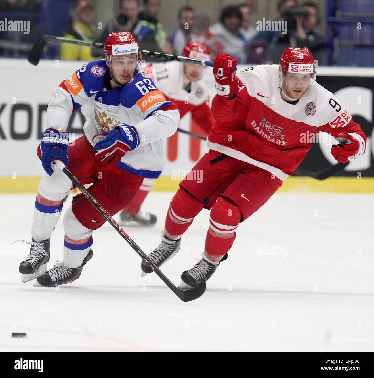 From left: Yevgeni Dadonov (RUS) and Frederik Storm (DNK) fight for a puck during the Ice Hockey World Championship Group B match Russia vs Denmark in Ostrava, Czech Republic, May 6, 2015. (CTK Photo/Petr Sznapka) Stock Photo