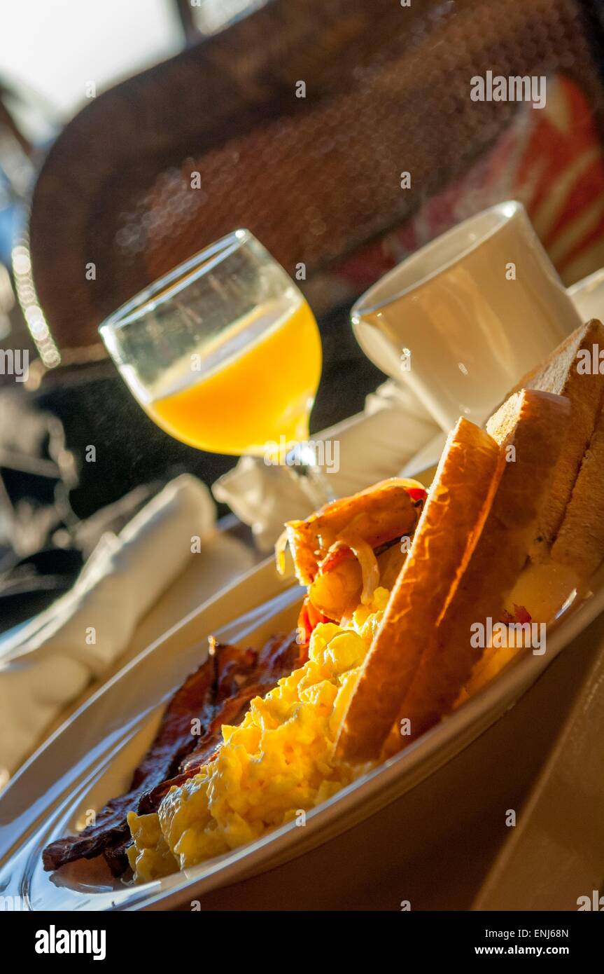 Typical American breakfast of scrambled eggs, bacon, fingerling
