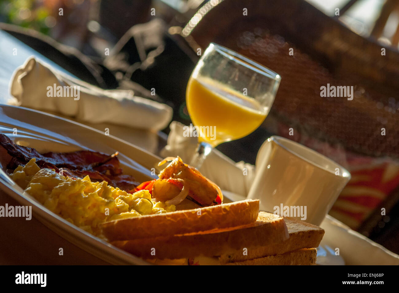 Typical American breakfast of scrambled eggs, bacon, fingerling potatoes, toast, orange juice & coffee. Cheeca Lodge & Spa, Florida, USA Stock Photo