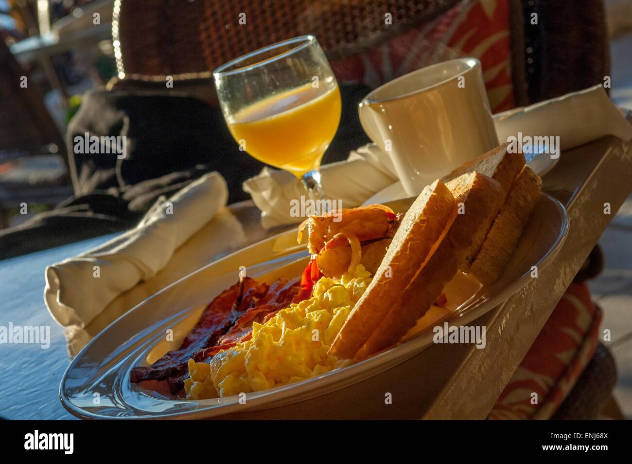 Typical American breakfast of scrambled eggs, bacon, fingerling potatoes, toast, orange juice & coffee. Cheeca Lodge & Spa, Florida, USA Stock Photo