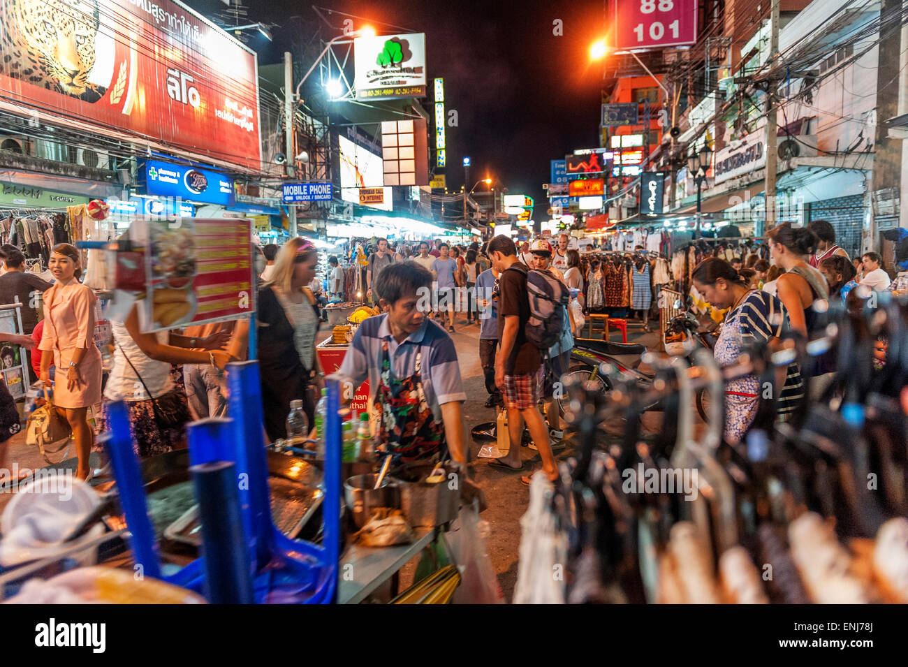 Street traders, locals and tourists mingle along the Khao San Road at night. Bangkok. Thailand. Stock Photo