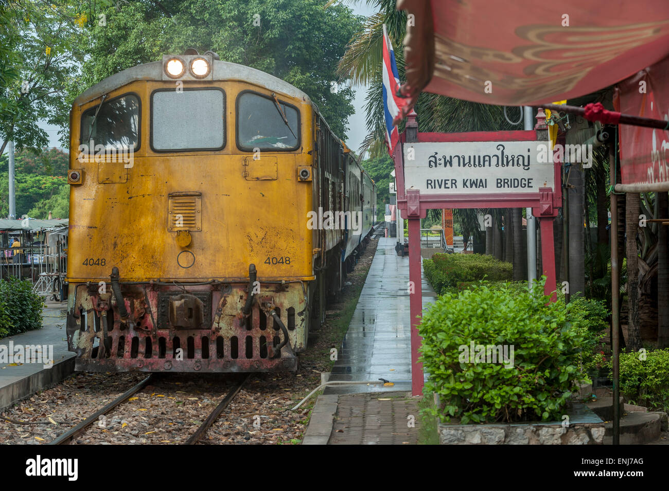 Train approaching the River Kwai Bridge railway station. Kanchanaburi, Kanchanaburi Province. Thailand Stock Photo