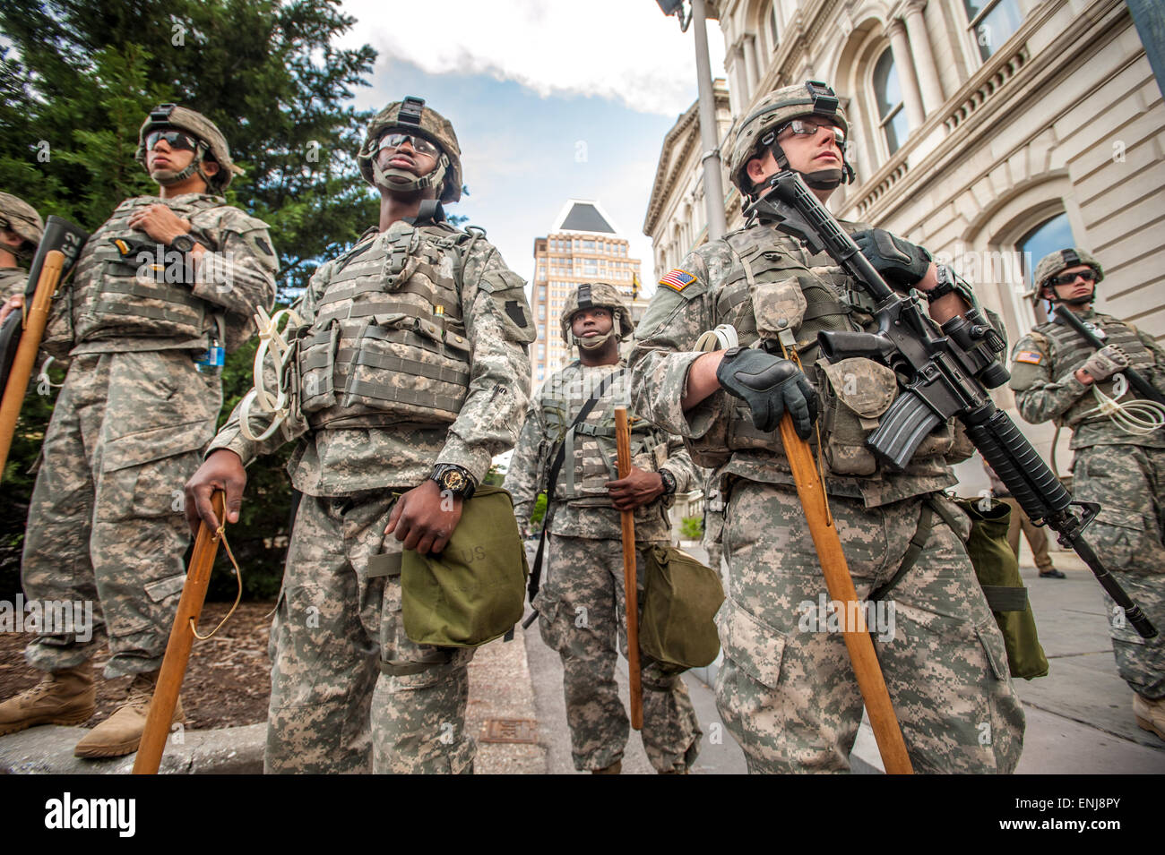 National Guard unit watching over the protests going on in Baltimore near City Hall after the cop related death of Freddie Gray erupted in violent riots, turned to peaceful demonstrations Stock Photo