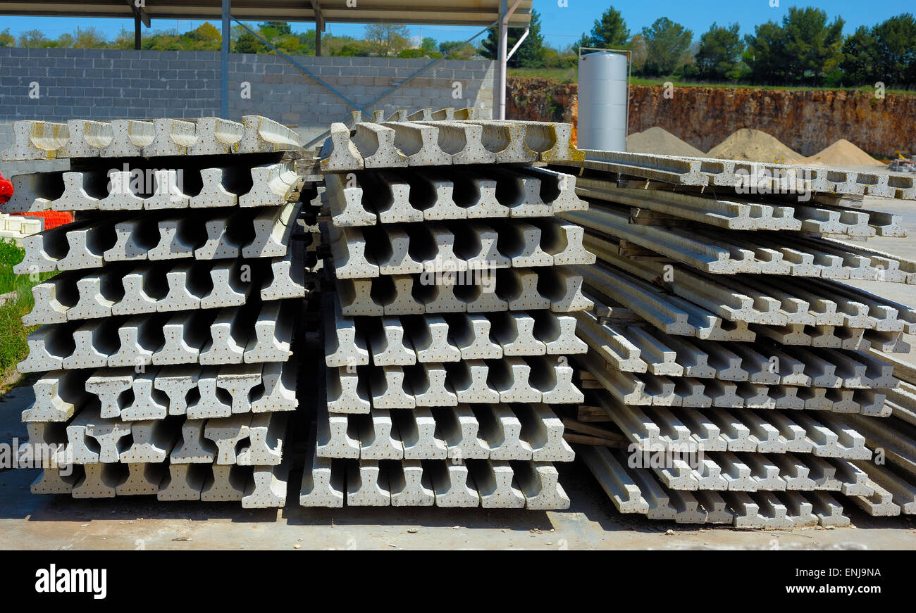 Construction job site prestressed concrete beams building materials Stock Photo