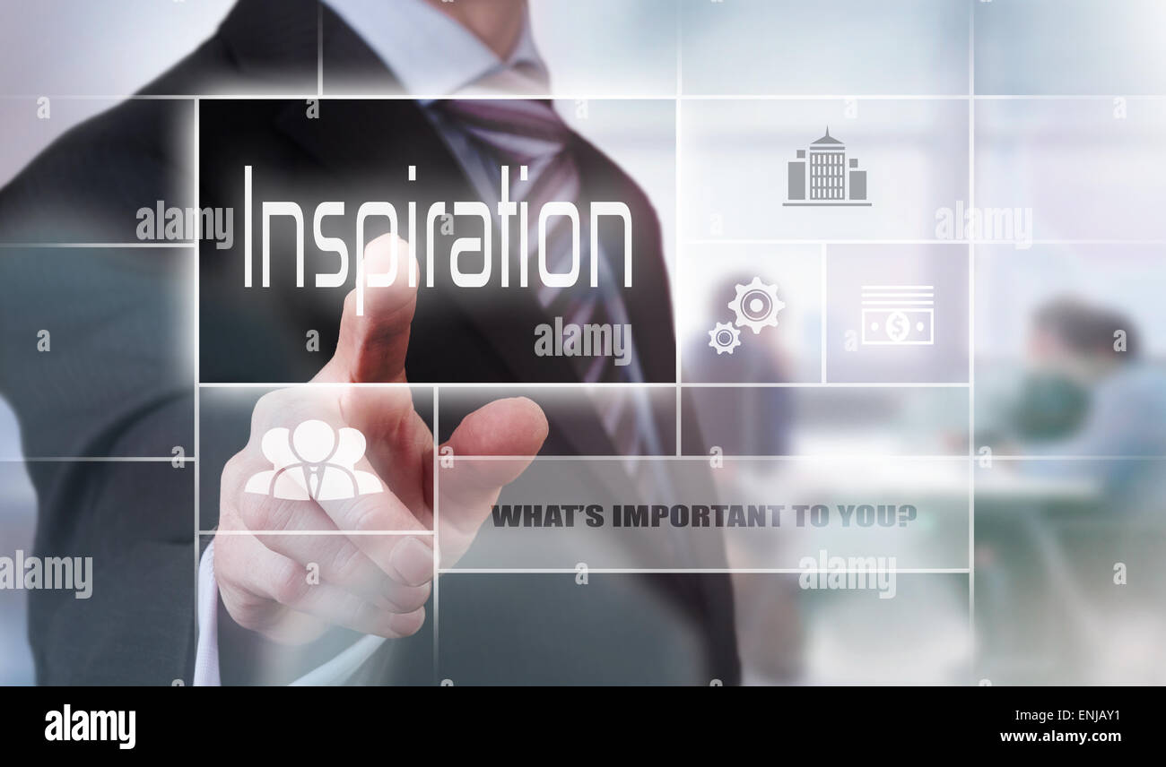 Businessman pressing an Inspiration concept button. Stock Photo