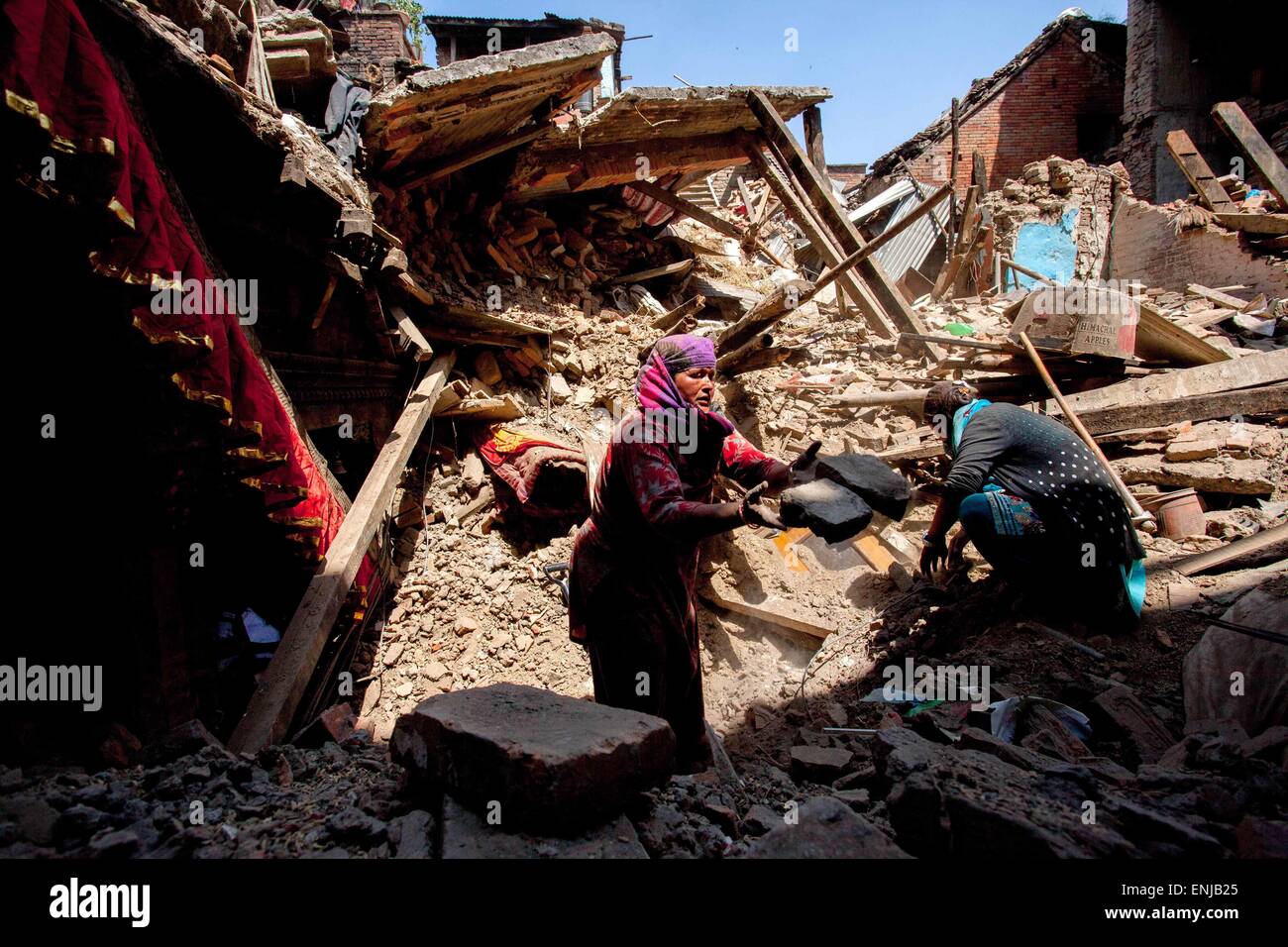 May 3, 2015 - May 3, 2015 - Kathmandu, Nepal- Earthquake victim search their belongings from their damage house after following massive earthquake magnitude-7.8 hit the country on 25 April 2015 in Bhaktapur dipstick Kathmandu, Nepal. School of Civil and Environmental Engineering Associate Professor Linlin Ge said the displacement was less than expected, prompting fears the stress that caused the initial earthquake may not have been fully released. ''It should be roughly several meters, '' he said. There are a lot of concerns about what is to come in terms of aftershocks, because the ground dis Stock Photo